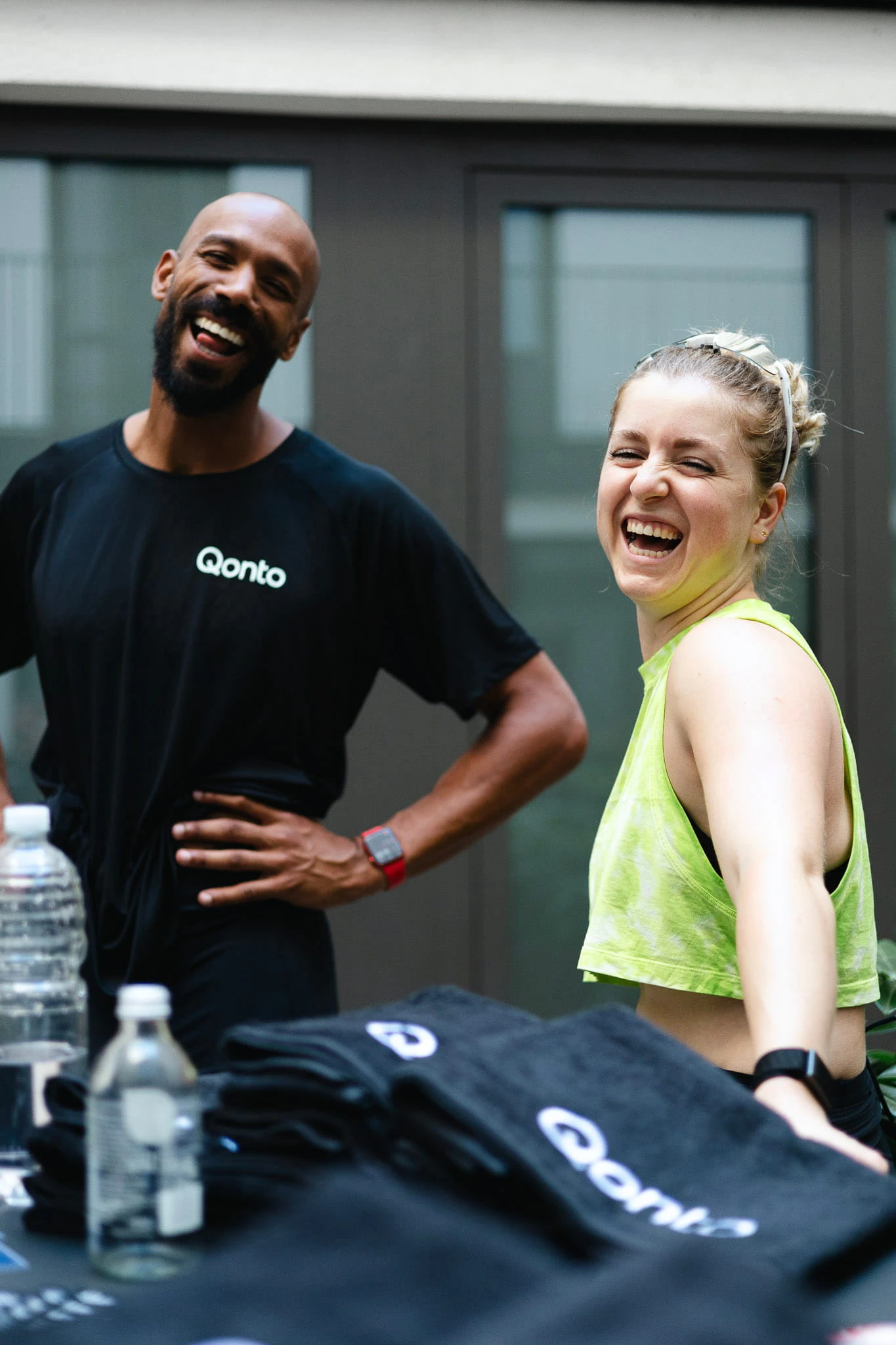 Ben Olayinka laughing with another runner at a RUN-N-RAVE event