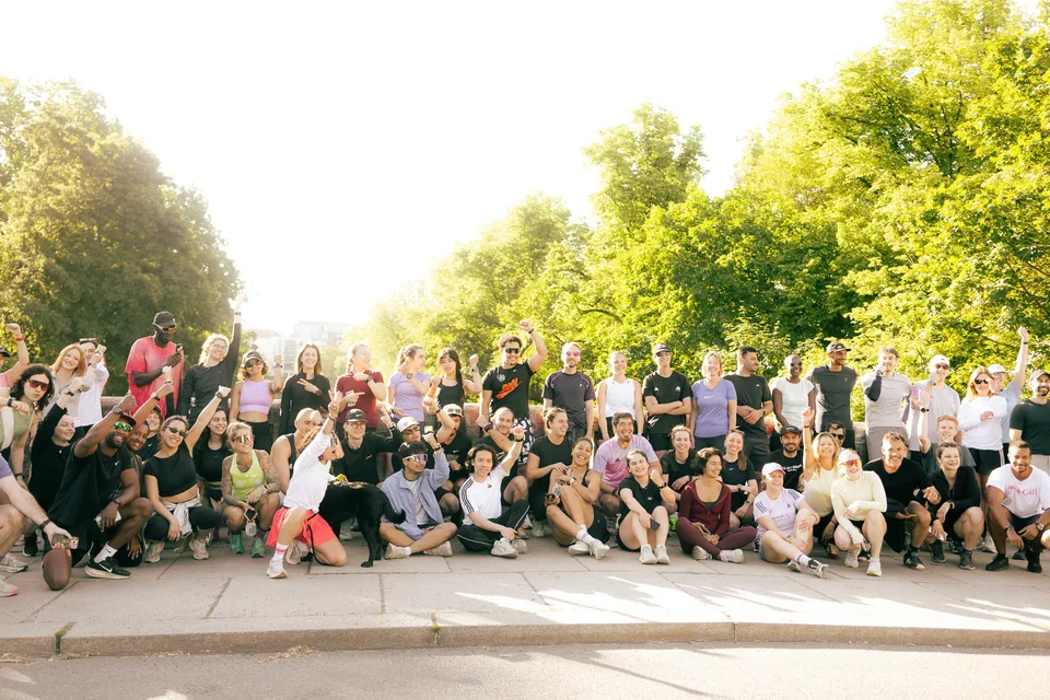 A large RUN-N-RAVE community gathered together in a Berlin park