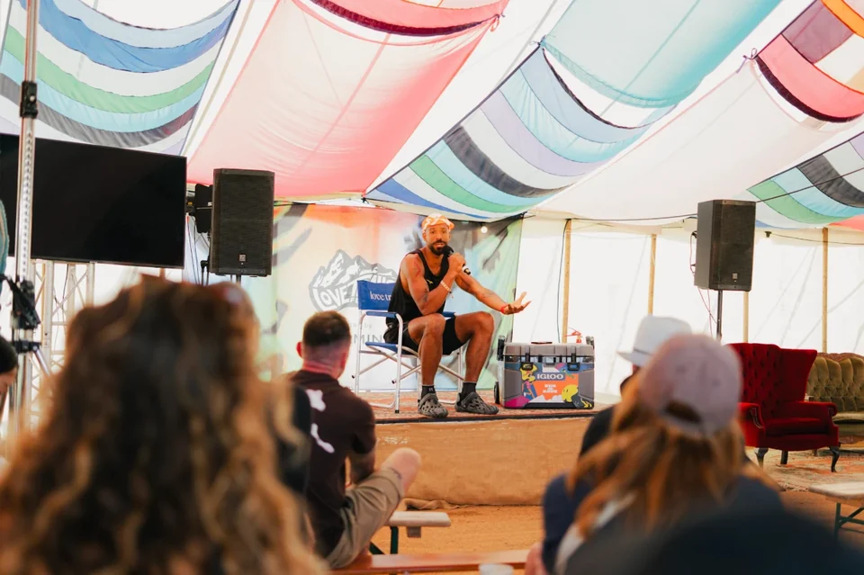 Ben speaking to an audience at Love Trails Festival